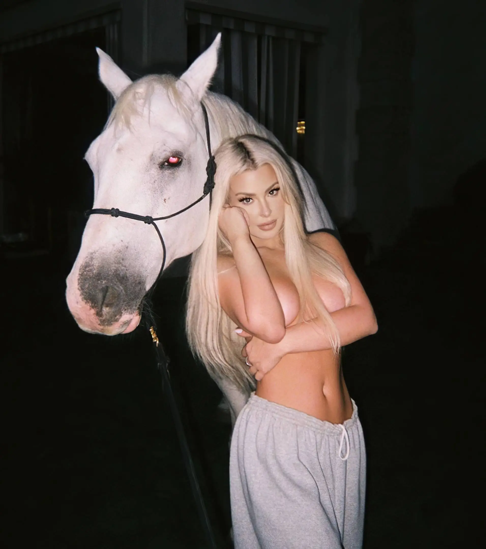 tana mongeau shows off her tits midriff in a white outfit
