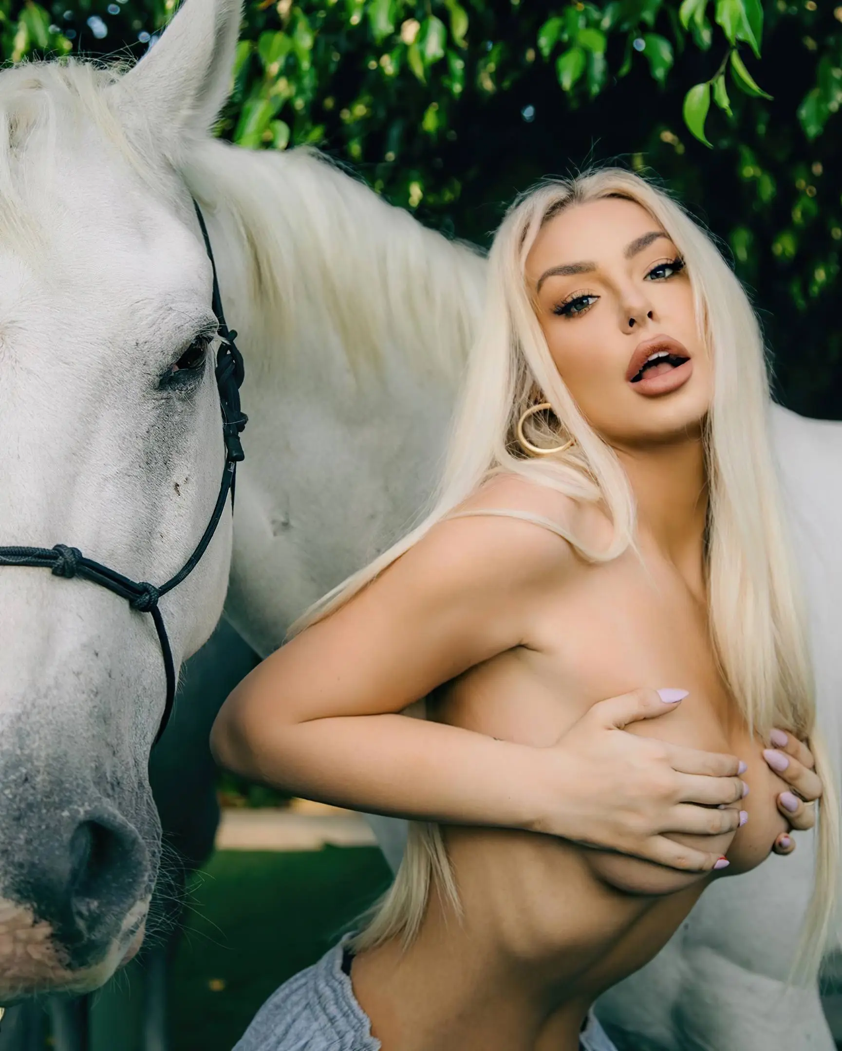 tana mongeau shows off her tits midriff in a white outfit