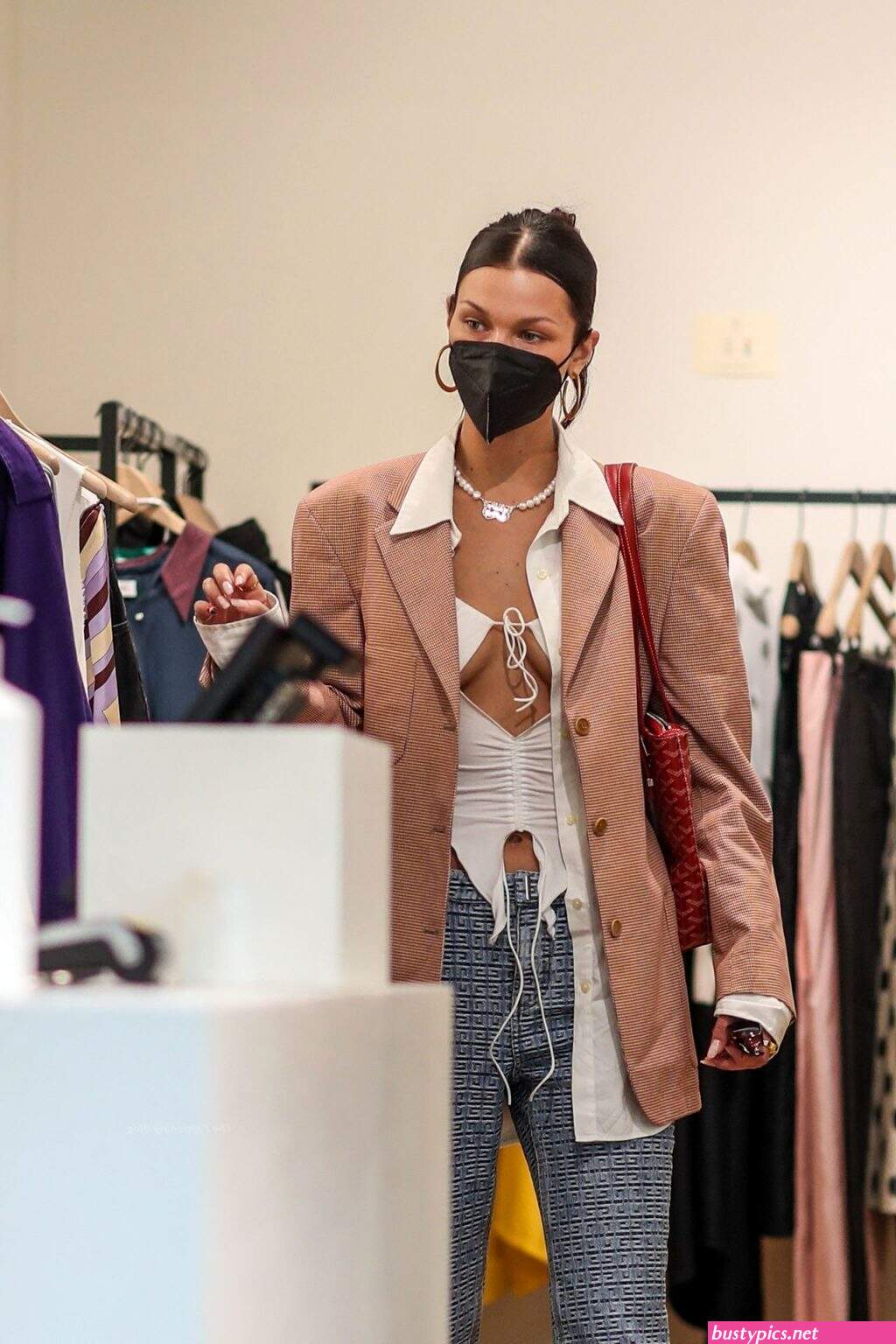 braless bella hadid steps out of the george v hotel with a friend