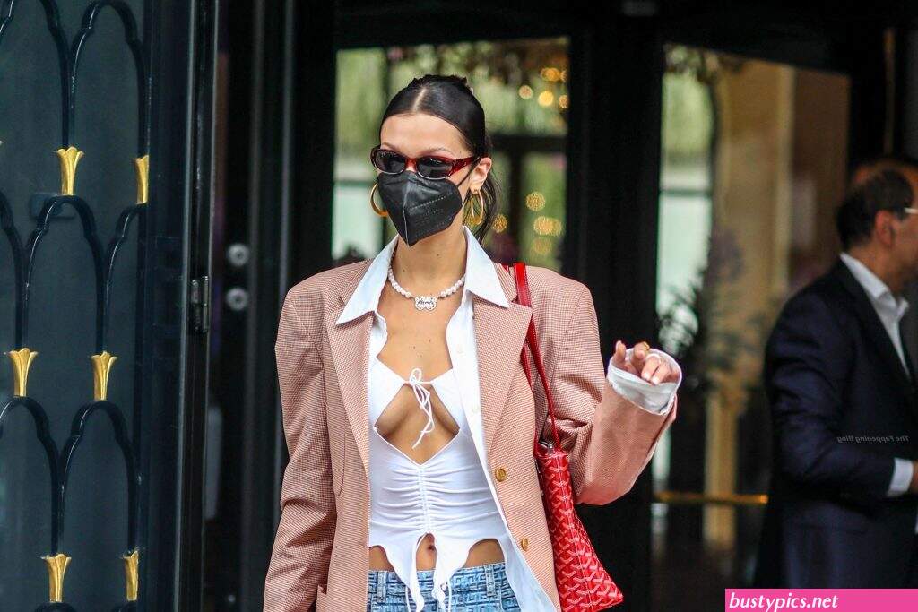 braless bella hadid steps out of the george v hotel with a friend
