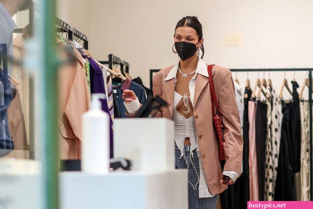 braless bella hadid steps out of the george v hotel with a friend