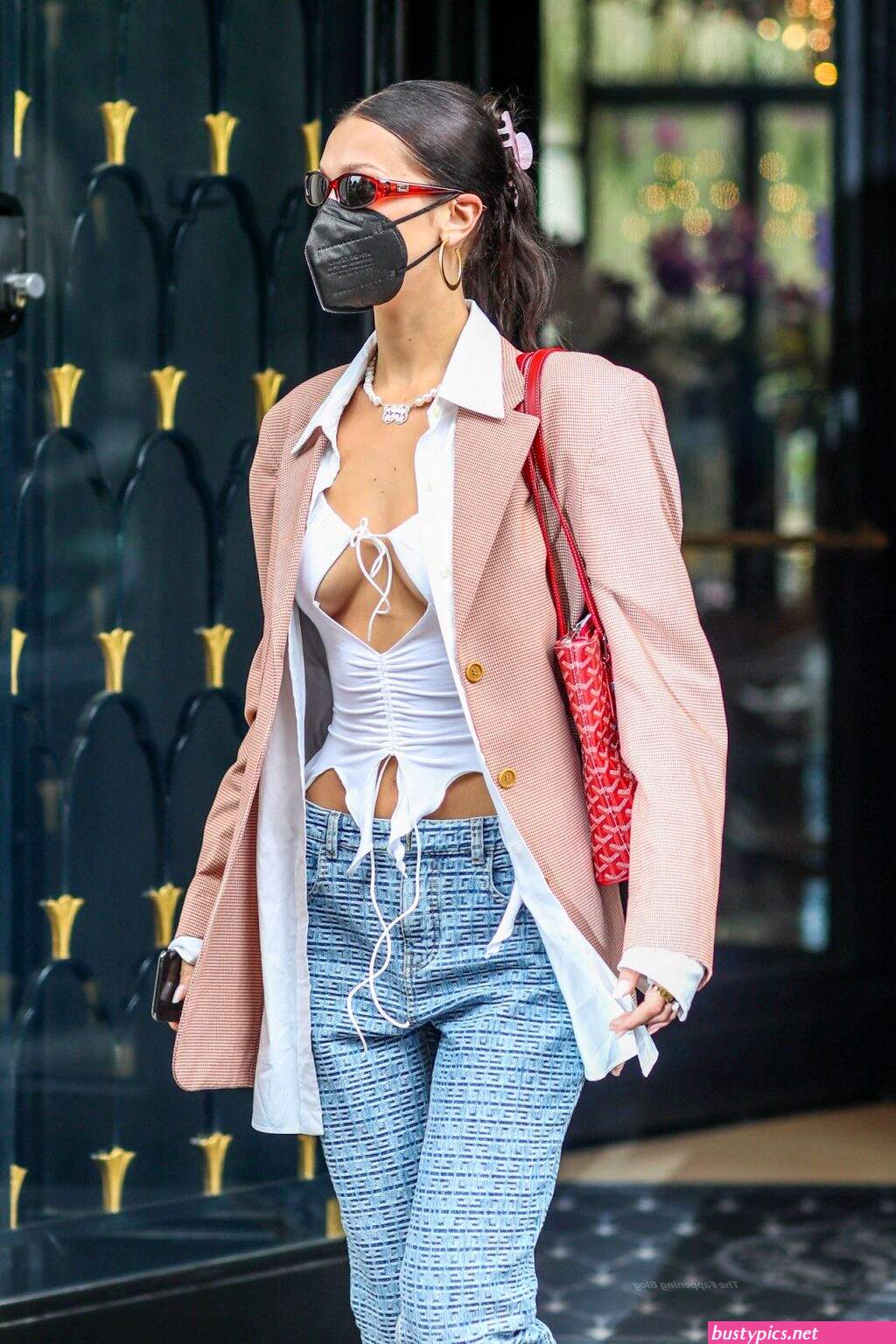 braless bella hadid steps out of the george v hotel with a friend