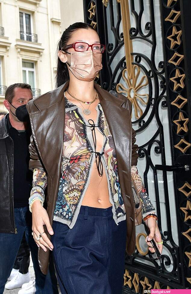 braless bella hadid steps out of the george v hotel with a friend