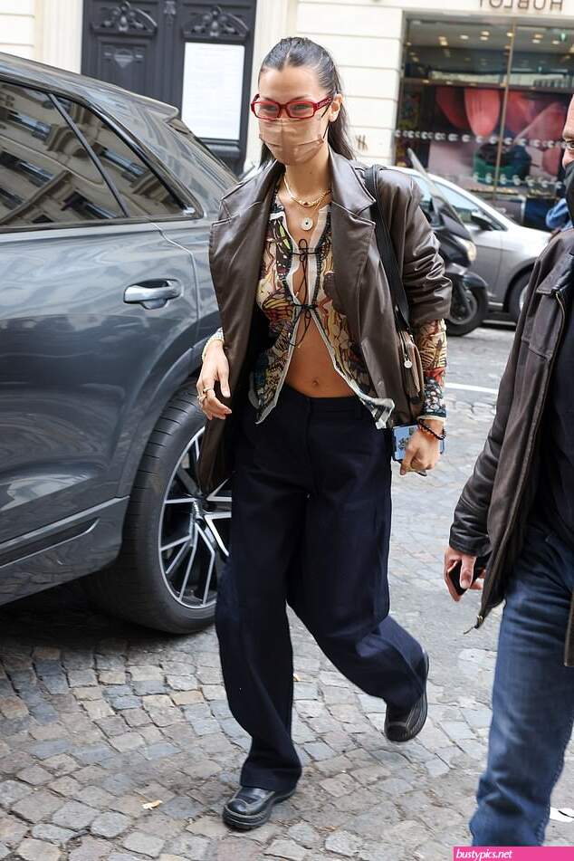 braless bella hadid steps out of the george v hotel with a friend
