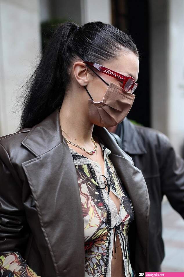 braless bella hadid steps out of the george v hotel with a friend