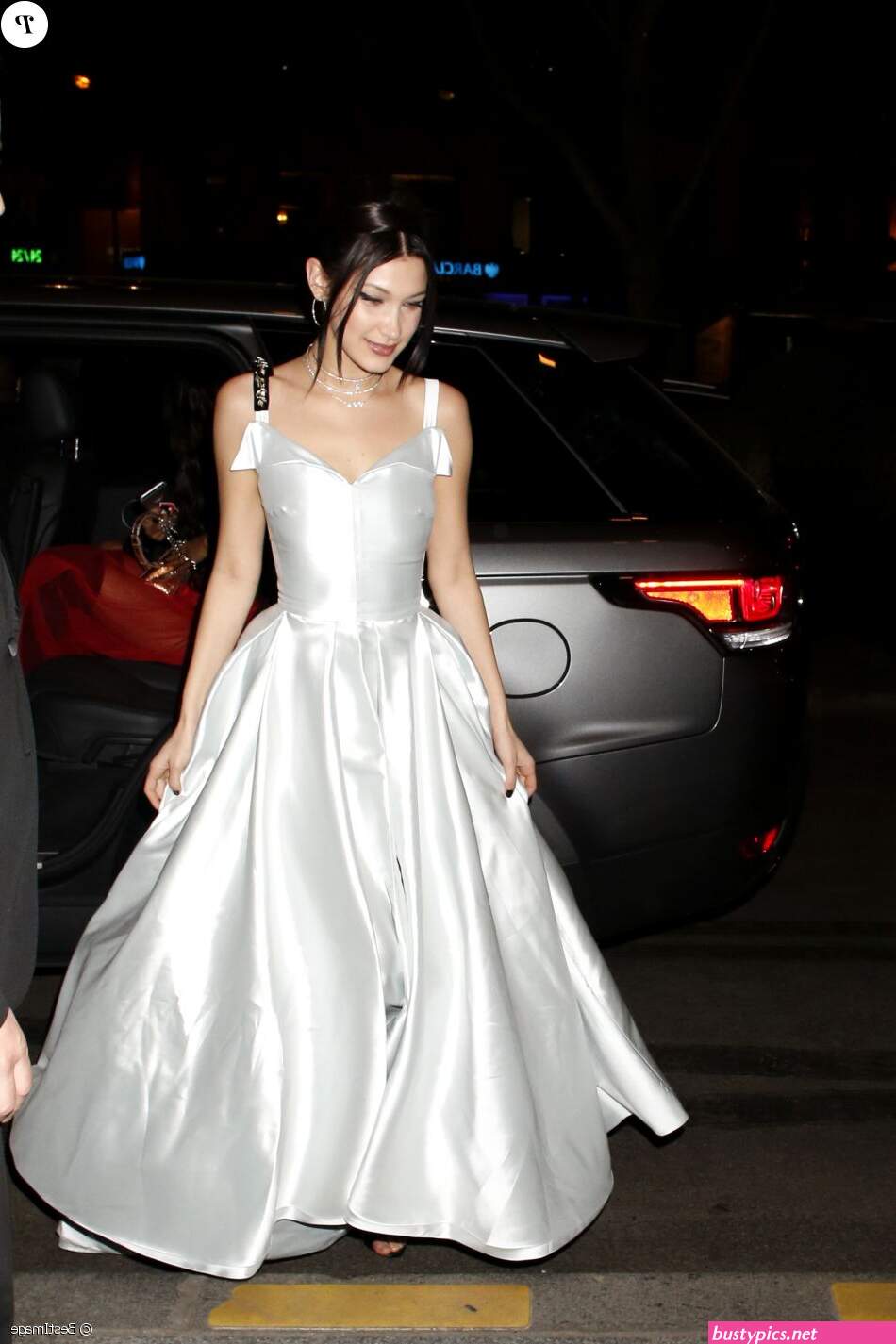 braless bella hadid steps out of the george v hotel with a friend