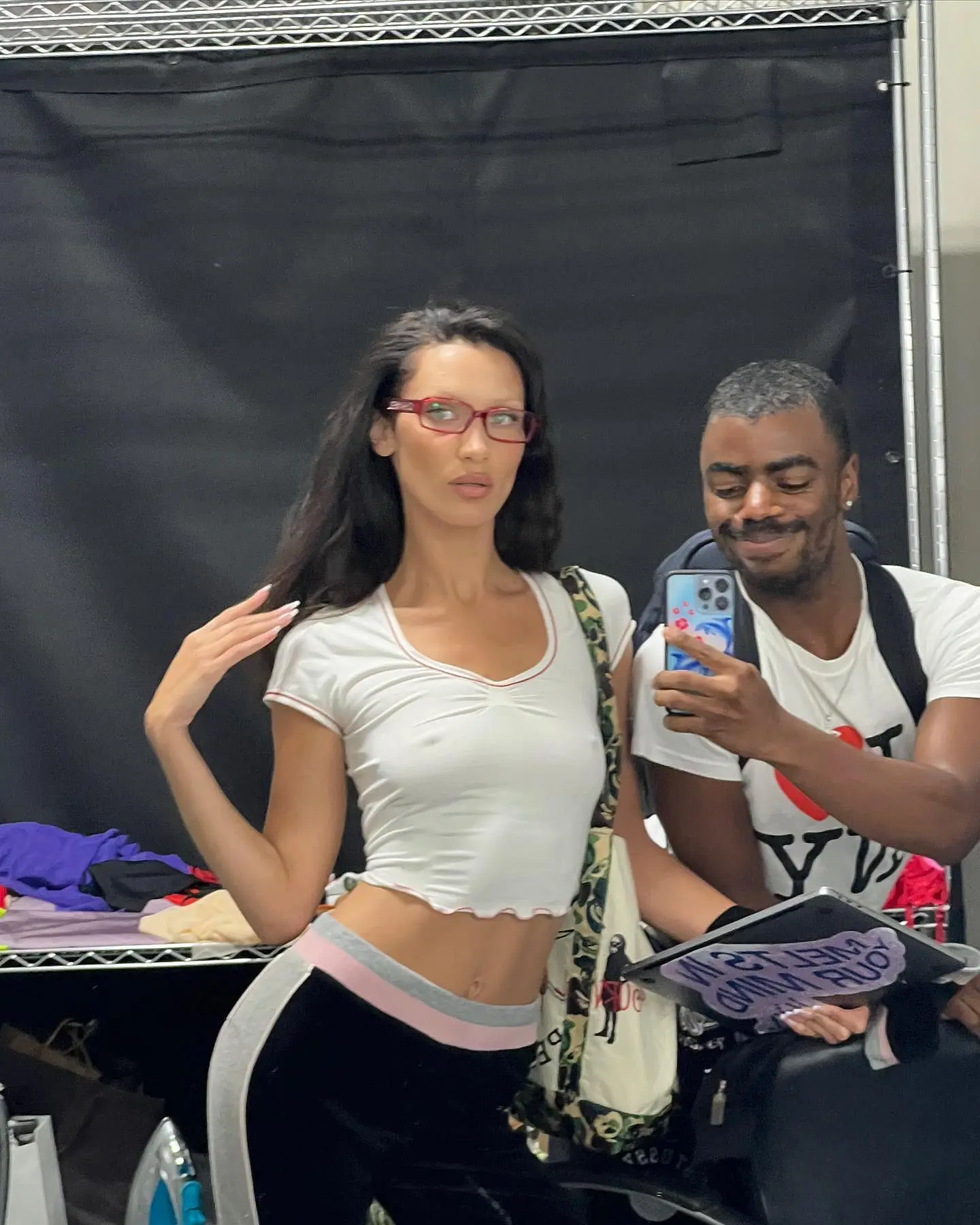 braless bella hadid steps out of the george v hotel with a friend