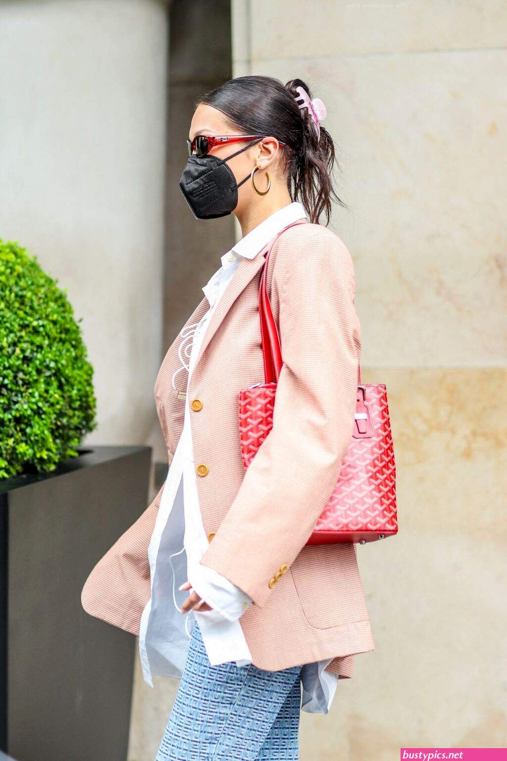 braless bella hadid steps out of the george v hotel with a friend