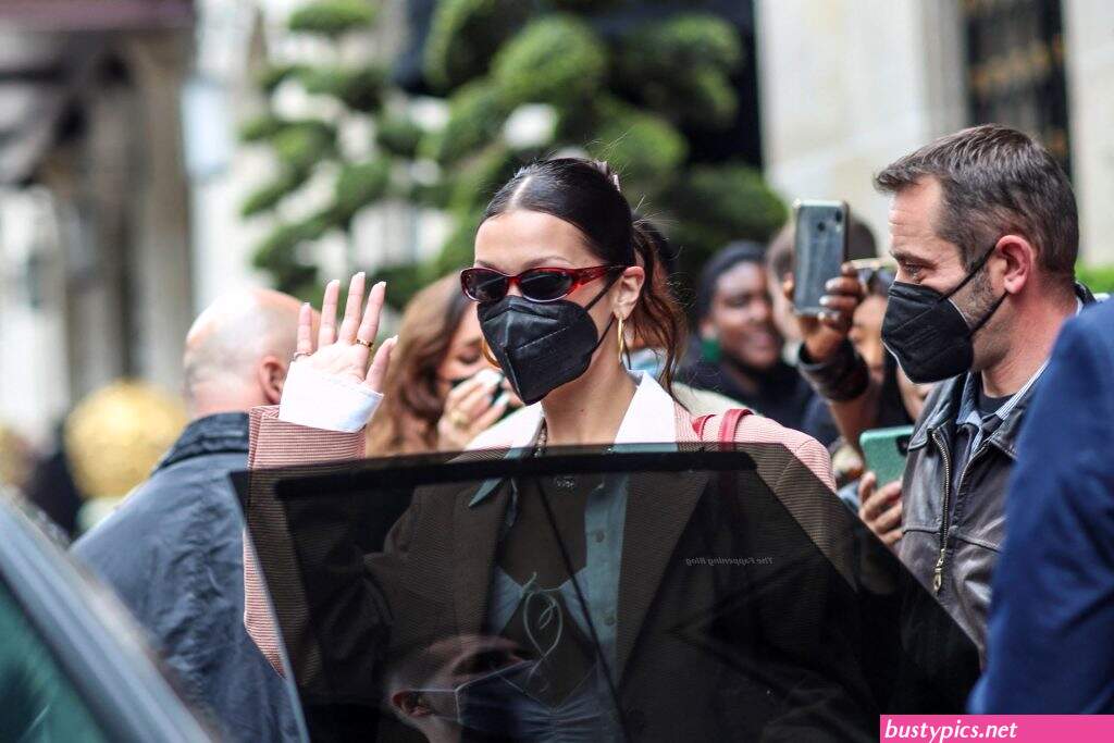 braless bella hadid steps out of the george v hotel with a friend