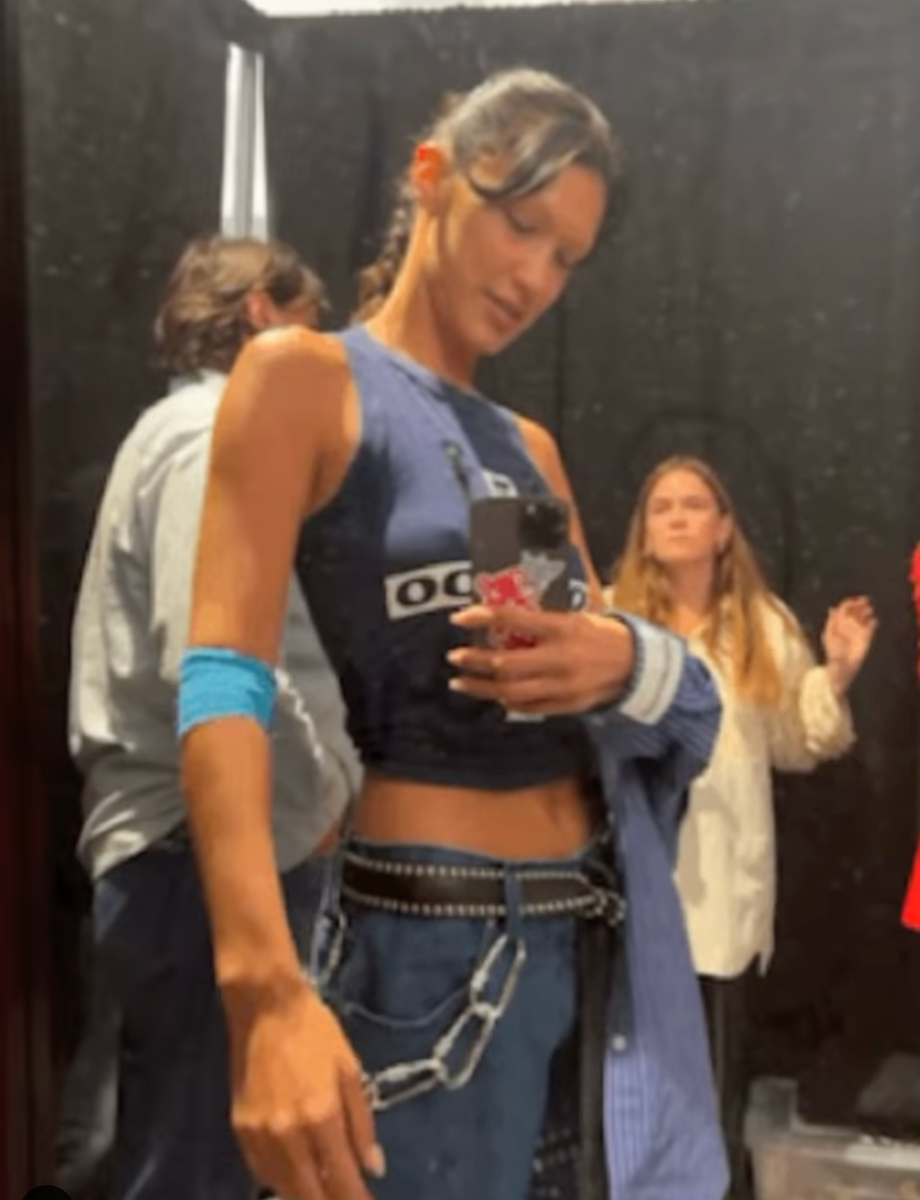 braless bella hadid steps out of the george v hotel with a friend