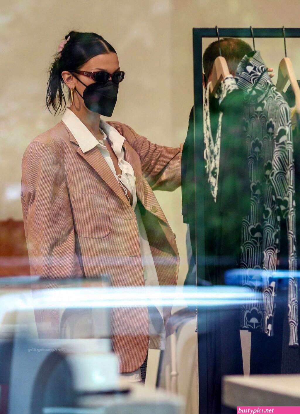 braless bella hadid steps out of the george v hotel with a friend