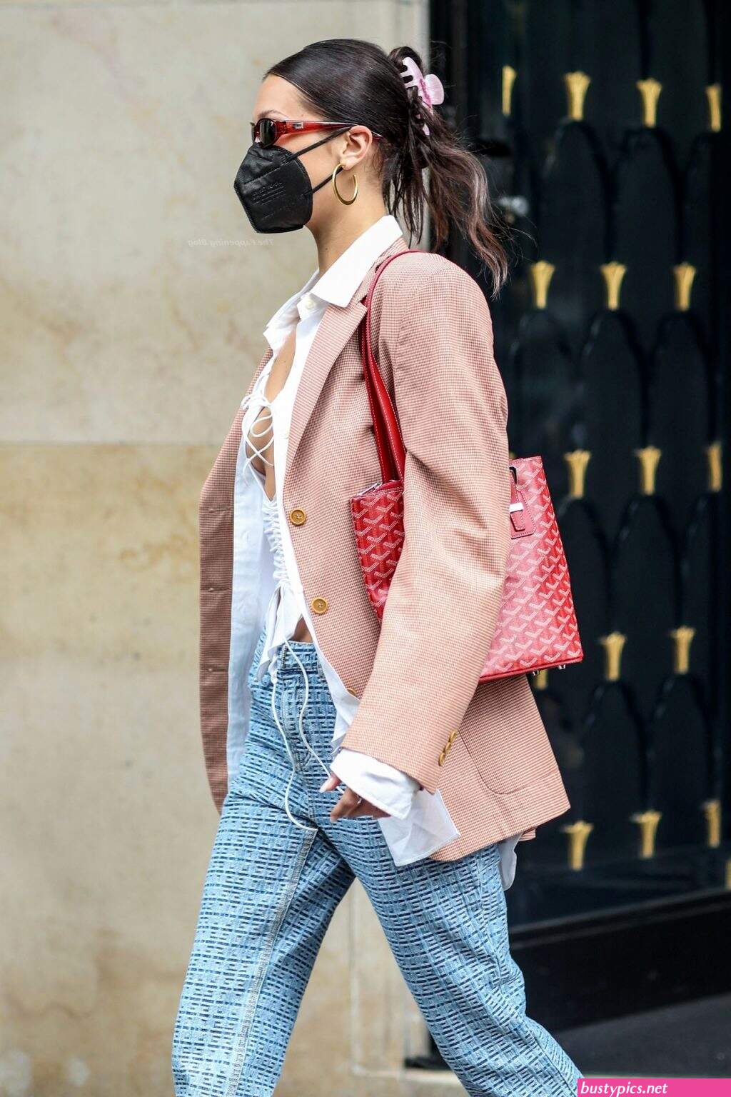 braless bella hadid steps out of the george v hotel with a friend