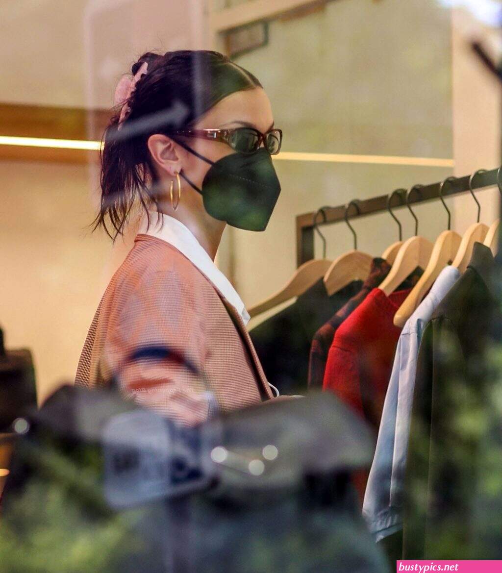 braless bella hadid steps out of the george v hotel with a friend