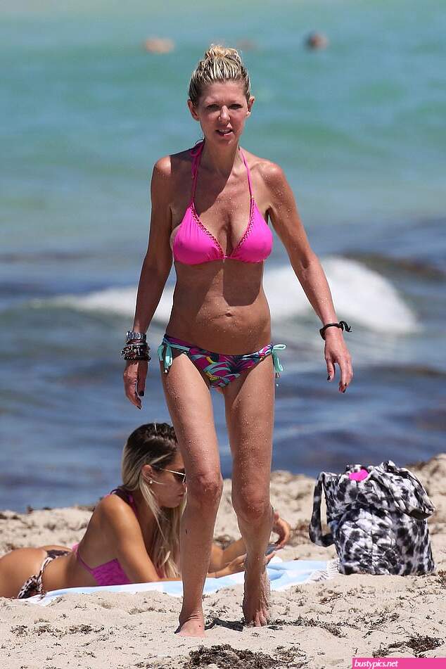 tara reid looks scary in a pink bikini