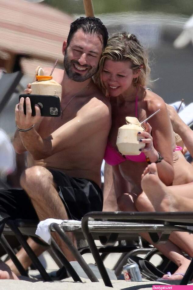 tara reid looks scary in a pink bikini