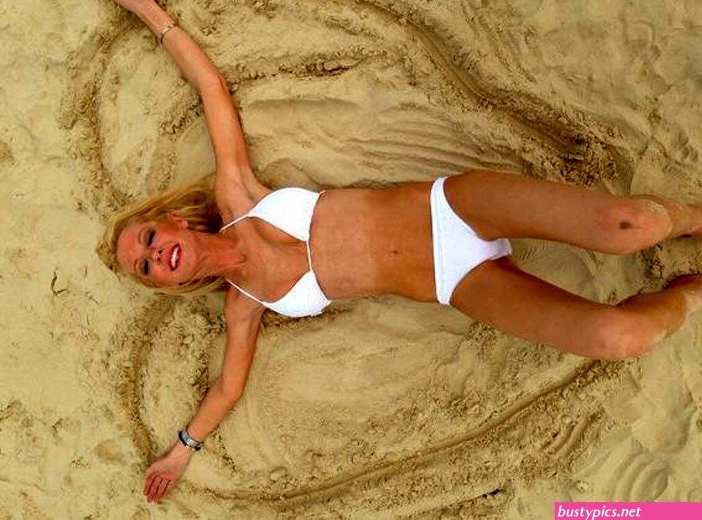 tara reid looks scary in a pink bikini