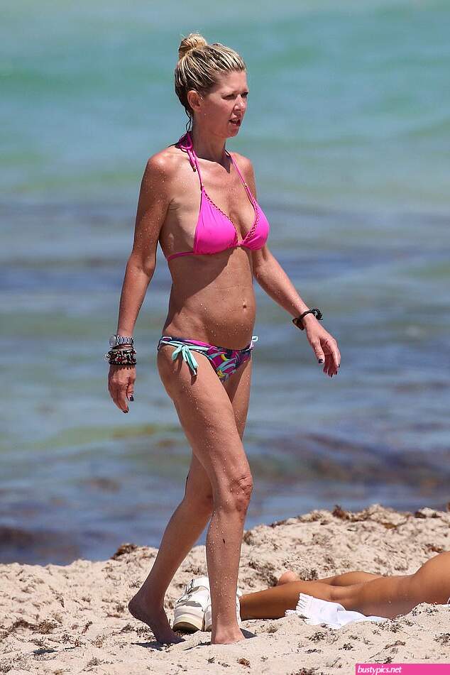 tara reid looks scary in a pink bikini