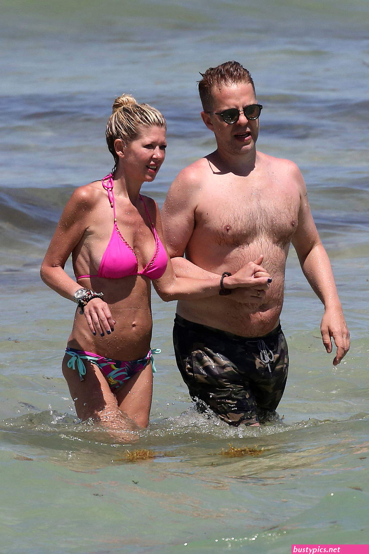 tara reid looks scary in a pink bikini