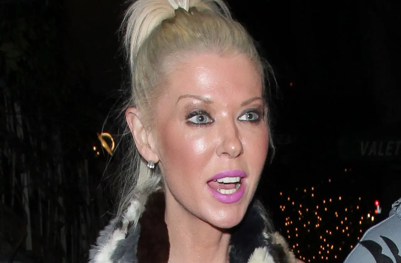 tara reid looks scary in a pink bikini