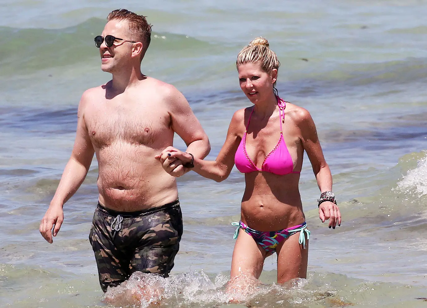 tara reid looks scary in a pink bikini