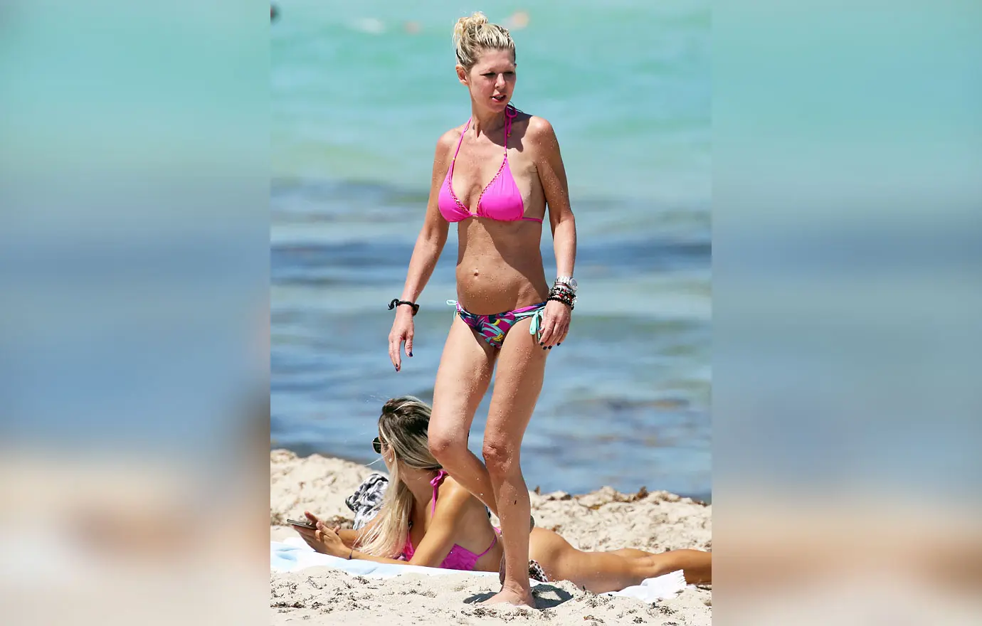 tara reid looks scary in a pink bikini